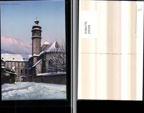 299398,Innsbruck Burggraben Kirche Turm Bergkulisse Winterbild