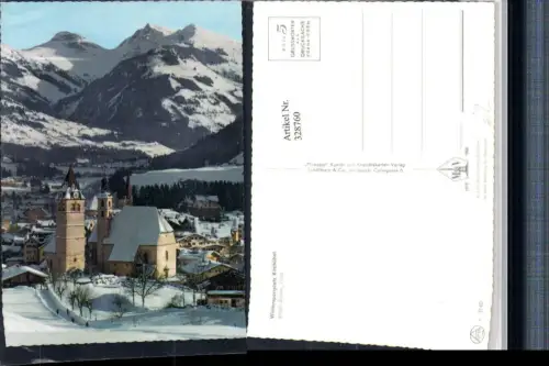 328760,Kitzbühel Teilansicht Kirche Bergkulisse Winterbild