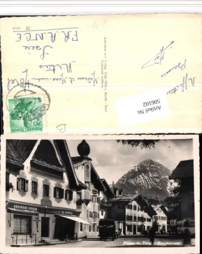 506102,Reutte Hauptstraße Straßenansicht Friseur Adalbert Singer Bergkulisse