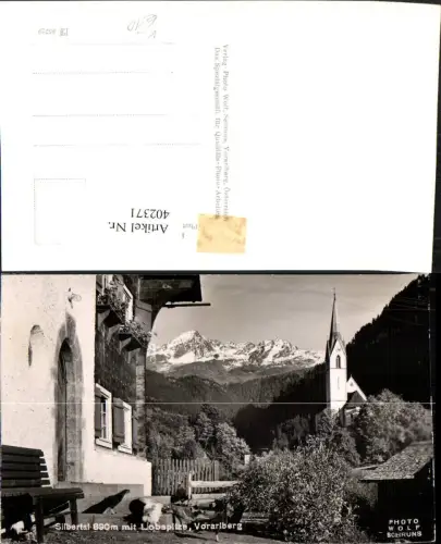 402371,Silbertal Kirche m. Lobspitze Bergkulisse pub Foto Wolf