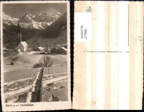 277866,Mittelberg Teilansicht Kirche m. Schafalpköpfe Bergkulisse Winterbild