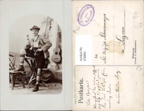 478891,Musikinstrument an Wand Mann m. Tracht Pfeife Rauchen pub Heinr. Fritz Bad Reichenau