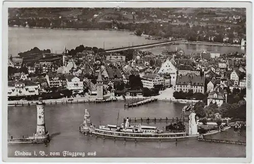 Lindau (Bodensee) Luftbild mit Stadt, Hafen und Dampfer 1932