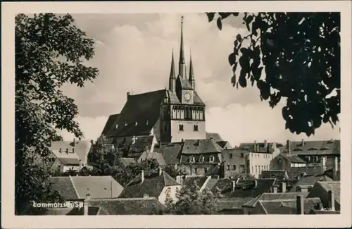 Ansichtskarte Lommatzsch Über den Dächern - Blick zur Kirche 1979