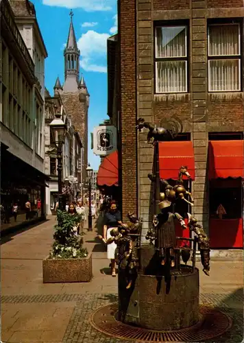 Ansichtskarte Aachen Krämerstraße mit Puppenbrunnen und Rathausturm c1995