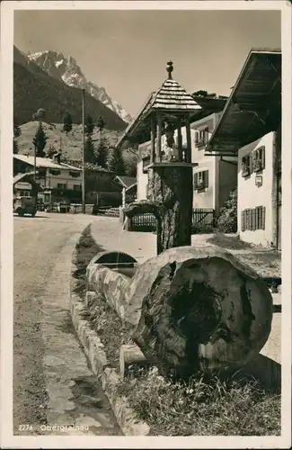 Ansichtskarte Grainau Obergrainau - geschnitzer Brunnen - Straße 1933