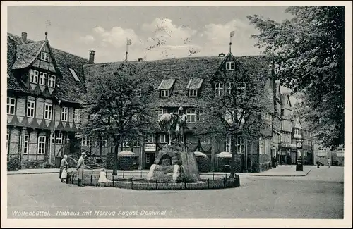 Ansichtskarte Wolfenbüttel Brunnen, Geschäfte - Uhr 1937