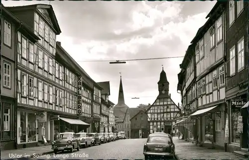 Ansichtskarte Uslar Lange Strasse, Auto div. Modelle, Autos & Geschäfte 1964