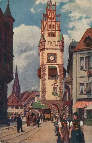 Freiburg im Breisgau Schwabentor Strasse belebt, signierte Künstlerkarte 1910