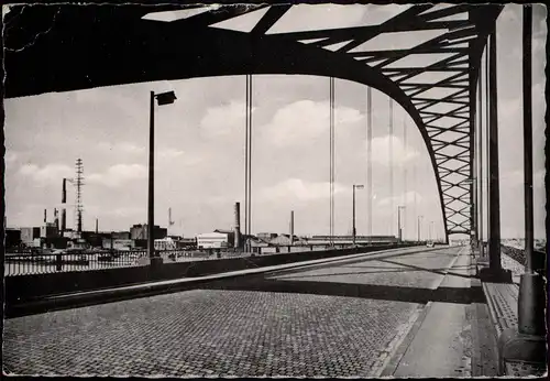 Rheinhausen-Duisburg Rheinbrücke Rhein Brücke im Hintergrund Fabriken 1964