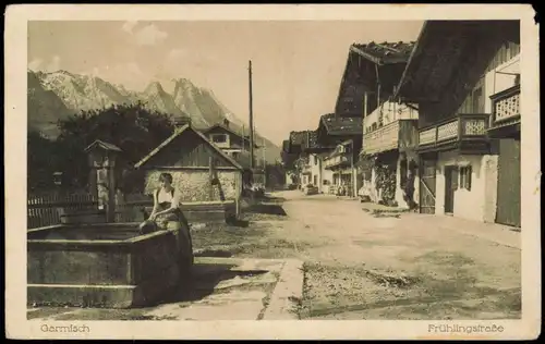 Ansichtskarte Garmisch-Partenkirchen Frühlingstrasse, Frau am Brunnen 1920