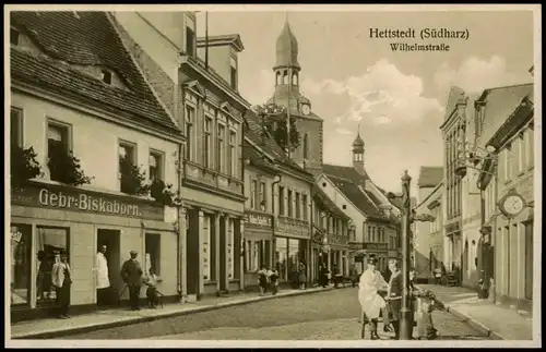 Ansichtskarte Hettstedt (Südharz) Wilhelmstraße, Geschäfte 1914