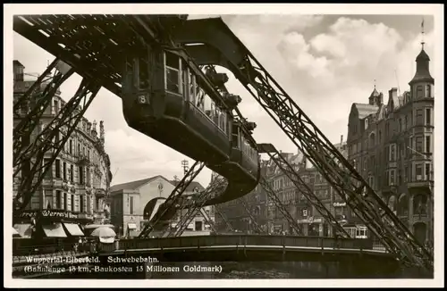 Ansichtskarte Elberfeld-Wuppertal Schwebebahn, Bahnhof und Geschäfte 1930