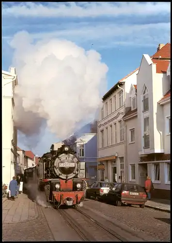 Ansichtskarte  Die Bäderbahn Molli auf der Fahrt i.d. Stadt Bad Doberan 1990