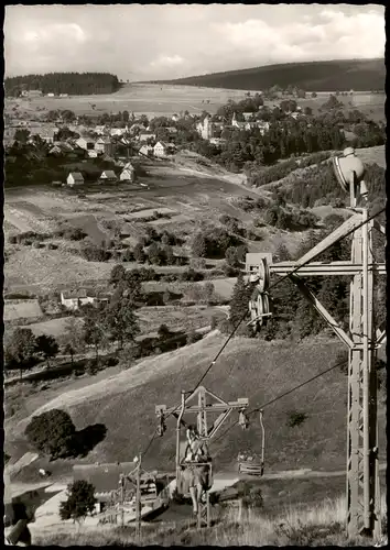 Ansichtskarte Sankt Andreasberg-Braunlage Stadt, Frau im Sessellift 1957