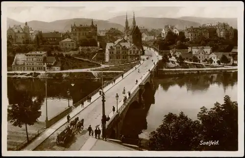 Ansichtskarte Saalfeld (Saale) Straßenpartie und Brücke, Fotokarte 1934