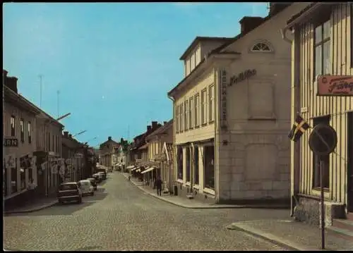 Postcard VIMMERBY Storgatan, Strassen-Ansicht, Autos u.a. VW Käfer 1976