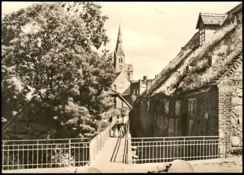 Friedland (Mecklenburg) Wassermühle mit Blick zur St. Marienkirche 1971