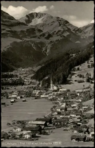 Ansichtskarte Holzgau Dorfansicht mit Kirche und Berggipfel Lärchspitze 1964